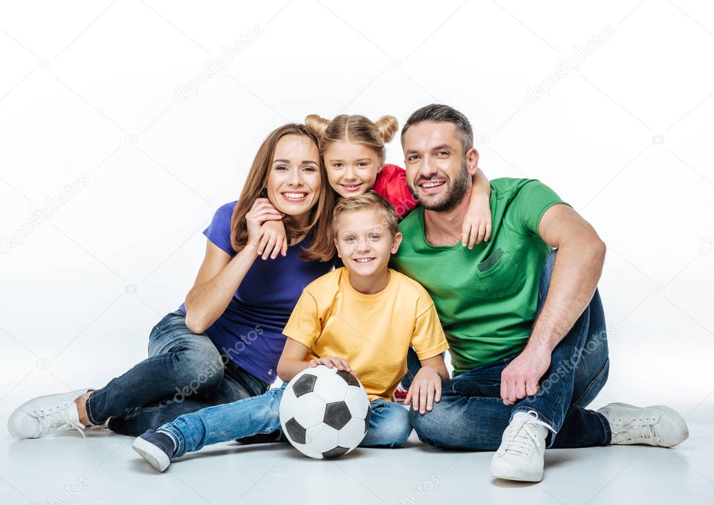 Happy family with soccer ball