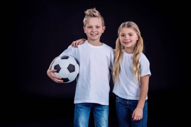 brother and sister posing with soccer ball clipart