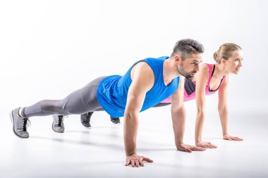 Couple doing plank exercise clipart