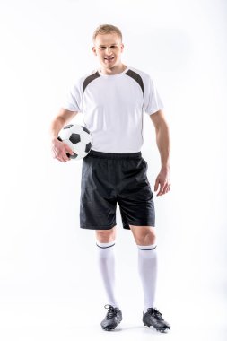 Soccer player exercising with ball clipart