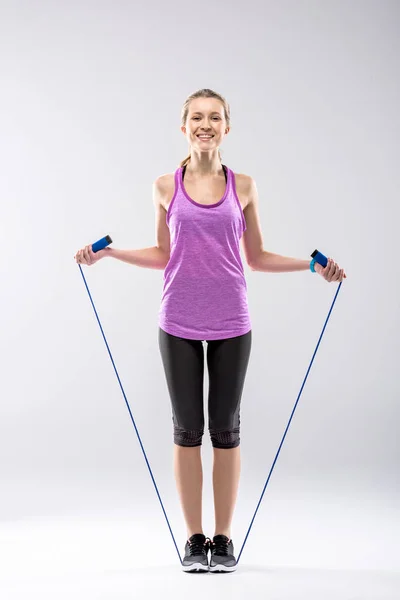 Woman exercising with skipping rope — Stock Photo, Image