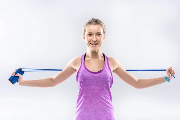 Woman exercising with skipping rope — Stock Photo, Image