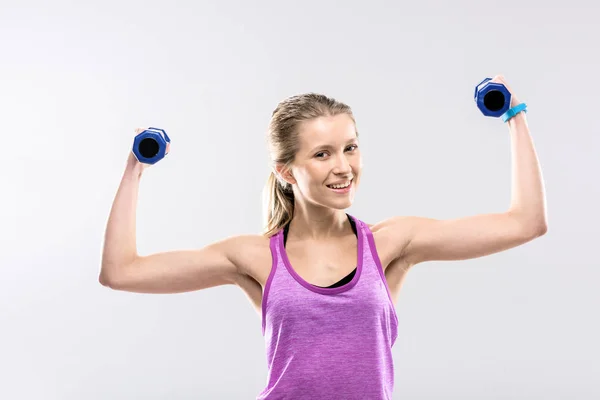 Woman exercising with dumbbells — Stock Photo, Image