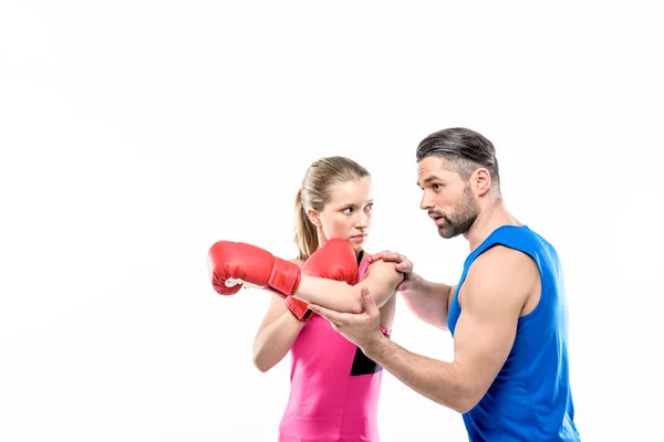 Girl practicing boxing with trainer — Stock Photo, Image