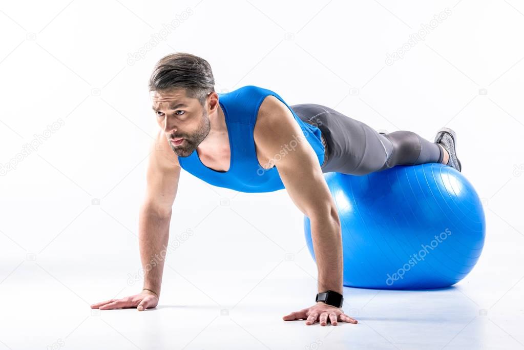 Man exercising on fit ball