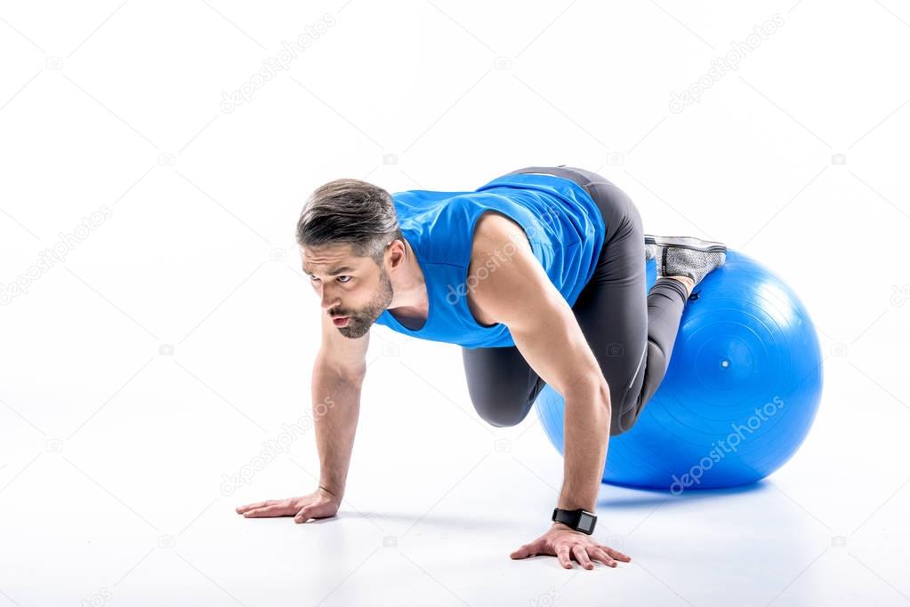 Man exercising on fit ball