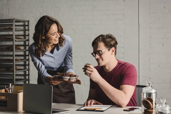 Bakers examining pastries — Stock Photo, Image