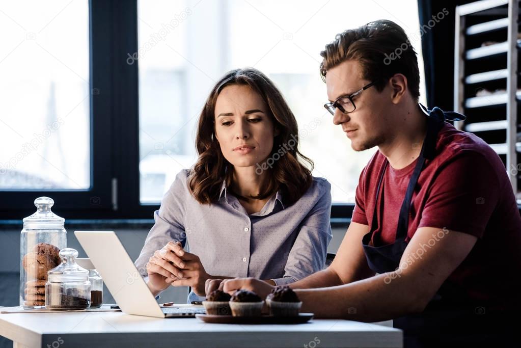 Bakers using laptop