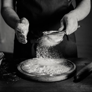 Baker sifting flour clipart