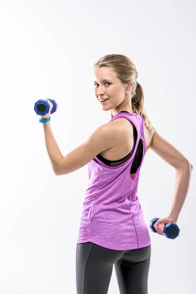 Mujer haciendo ejercicio con pesas - foto de stock