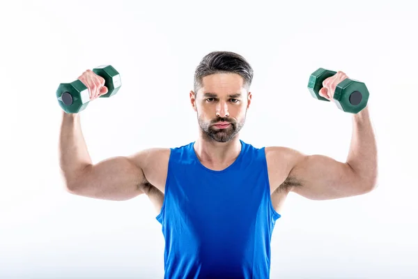 Uomo che si esercita con i manubri — Foto stock