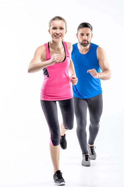 Hombre y mujer trotando - foto de stock