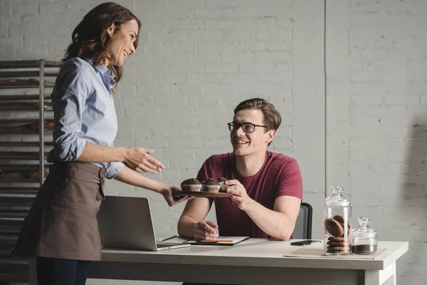 Bakers examining pastries — Stock Photo