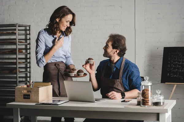 Bakers examining pastries — Stock Photo