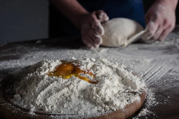 Baker kneading dough — Stock Photo