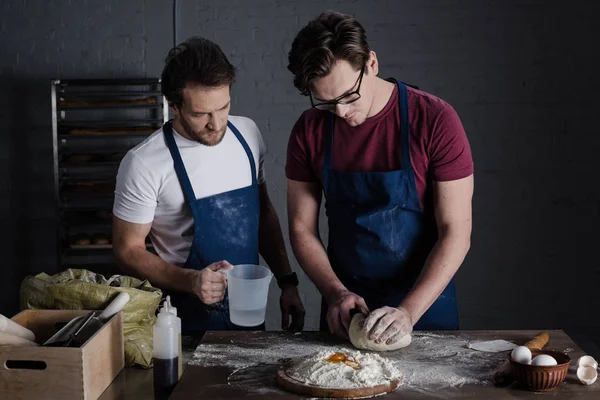 Bakers preparing dough — Stock Photo