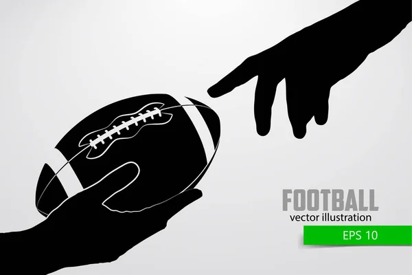 Main tient la balle de rugby, silhouette — Image vectorielle