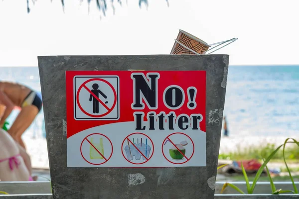 Local no littering signboard on a beach,Clean beach