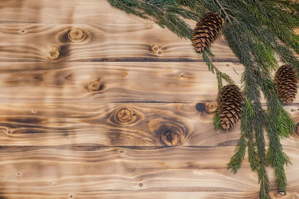 圣诞节的背景 木背云杉的圣诞枝条. — 图库照片