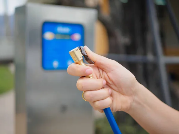 Driver checking air pressure and filling air in the tires close up — Stock Photo, Image