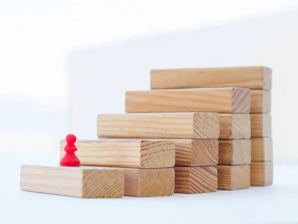 Concept of building success foundation. wooden blocks in the shape of a staircase