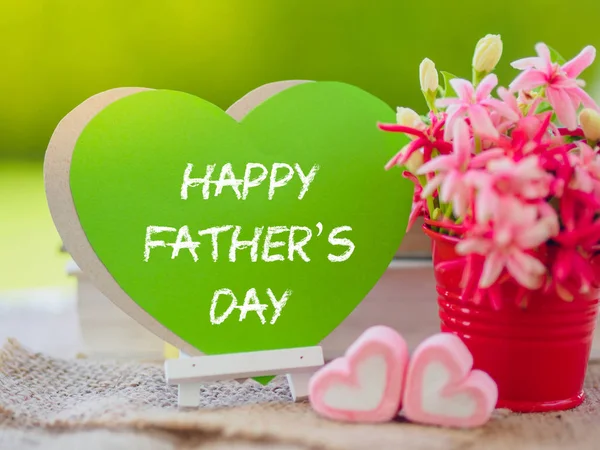 Father's day concept. Poster mock up template with flower bouquet, marshmallow in the shape of heart and books over green background with Happy Father's day text — Stock Photo, Image