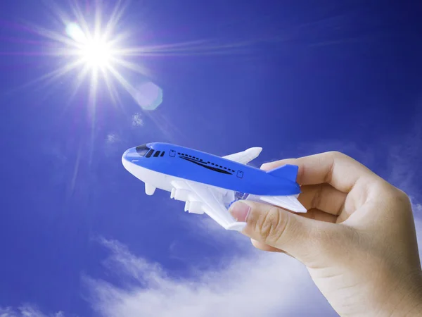 Close up kid hand holding an airplane model with Clipping path. Concepts of travel, transportation, transport, dreaming about holidays