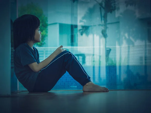 Soft focus little boy unhappy sad stitting in empty room — Stock Photo, Image