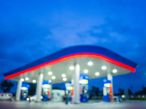 Blur image of twilight gas station during sunset. — Stock Photo, Image