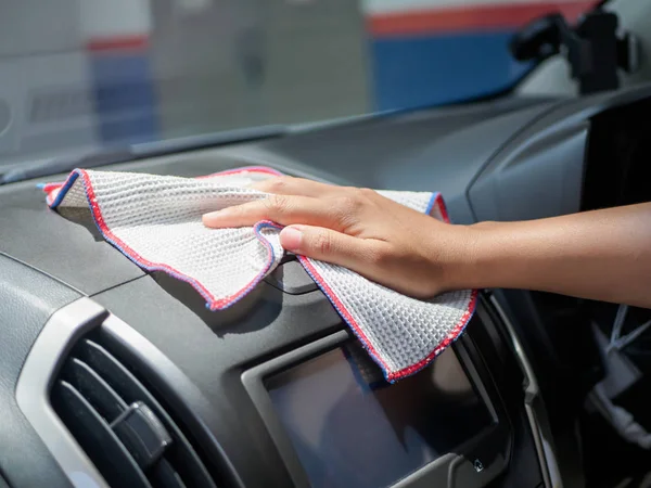 Hand cleaning interior car with microfiber cloth