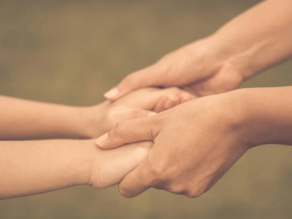 Retro woman  holds the hand of a lovely child. — Stock Photo, Image