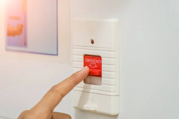 Closeup patient hand press emergency button in the hospital restroom. — Stock Photo, Image