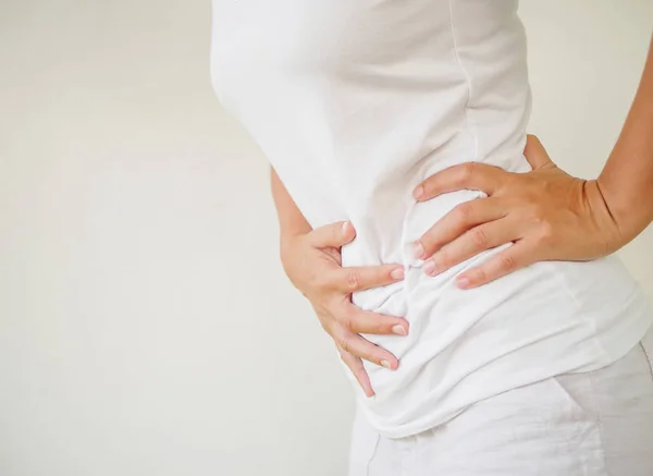 Woman having a stomachache, or menstruation pain — Stock Photo, Image