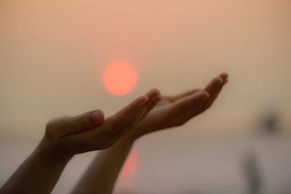 Closeup woman hands praying for blessing from god during  sunset — Stock Photo, Image