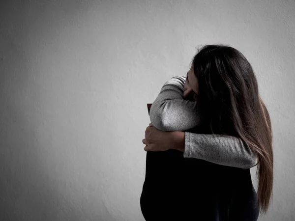 Depressed broken hearted woman sitting alone in dark room at home — Stock Photo, Image