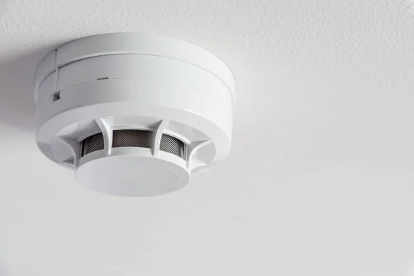 Close up smoke detector on a ceiling. — Stock Photo, Image