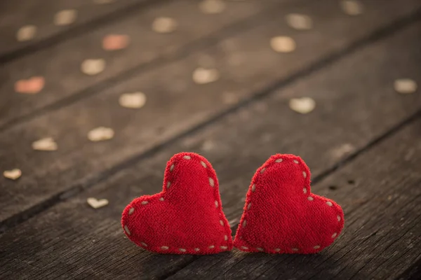 Two red heart with a lot of wooden hearts on wooden background — Stock Photo, Image