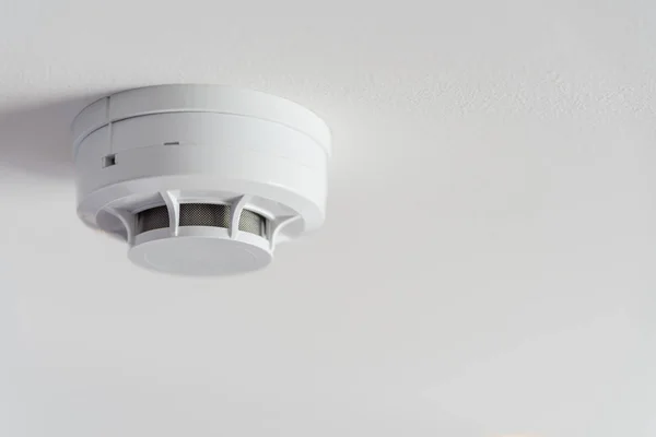 Close up smoke detector on a ceiling. — Stock Photo, Image