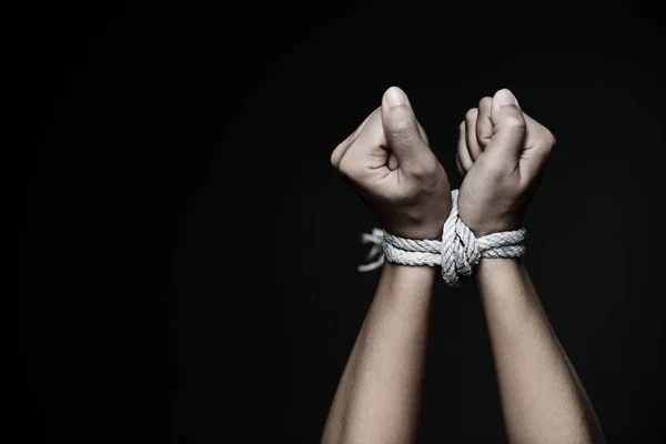 Closeup woman hands were tied with a rope. Stock Image