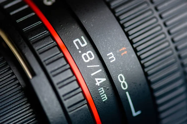 Macro shot of a camera lens focusing on camera lens information. — Stock Photo, Image