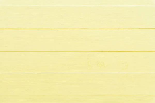 パステル調の明るい黄色の木製テーブル背景テクスチャ. — ストック写真