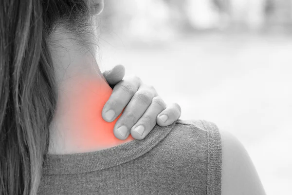 Closeup woman neck and shoulder pain and injury