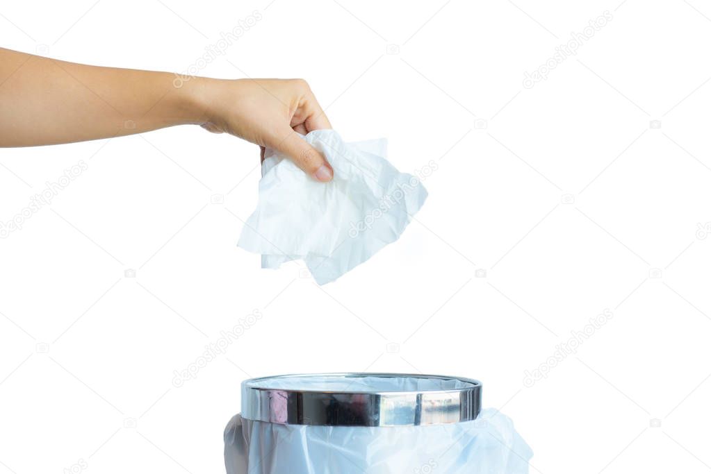 Women hand throwing white tissue paper in to a trash bin 