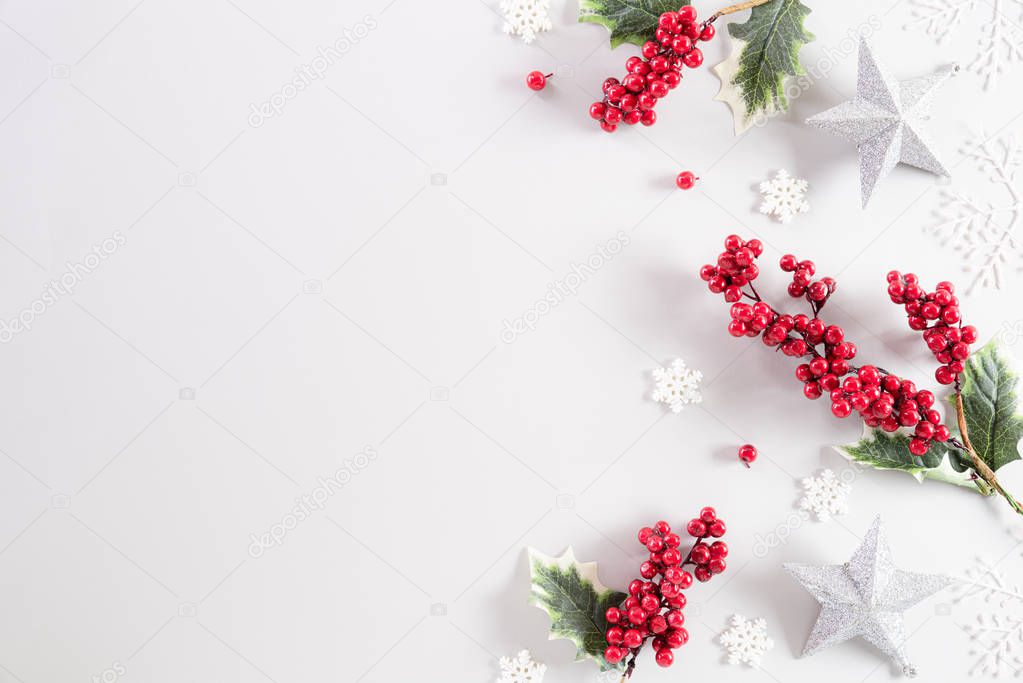Christmas background concept. Top view of Christmas ball with snowflakes and red berries on white background.