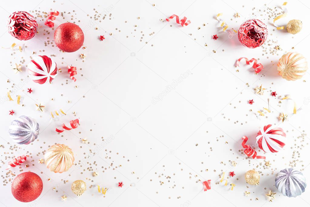 Christmas background concept. Top view of Christmas decoration, light golden and red pastel  ball, star with snowflakes on white background.