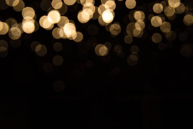 Siyah arkaplan ile soyut altın bokeh