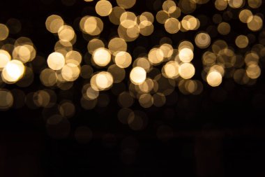 Siyah arkaplan ile soyut altın bokeh