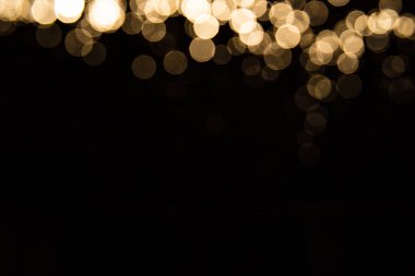 Siyah arkaplan ile soyut altın bokeh