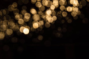Siyah arkaplan ile soyut altın bokeh