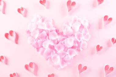 Small Pink paper hearts in shape of heart on Light pink pastel p